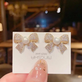 Crystal-Encrusted Bow Studs – Classic Pearl & Gold Design