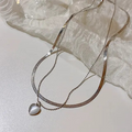 Elegant Dual Chain Necklace – White Heart Charm