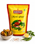 Marudhar Mixed Achaar package with a bowl of achaar, lemon, and green chilies on a white background