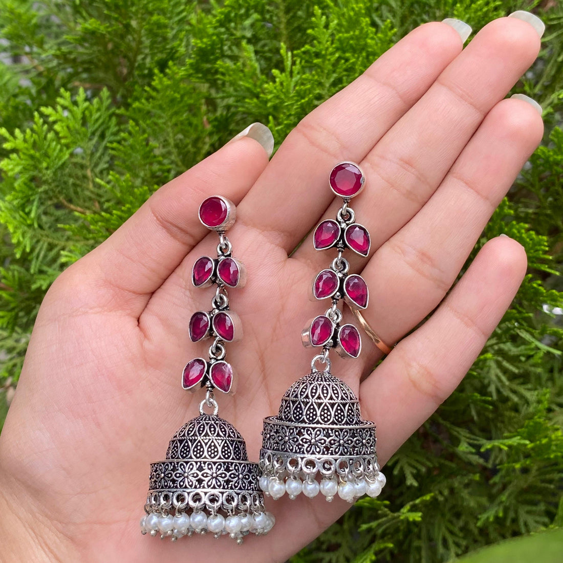 Ruby Cascade Jhumkas – A Flowing Symphony of Passion and Elegance