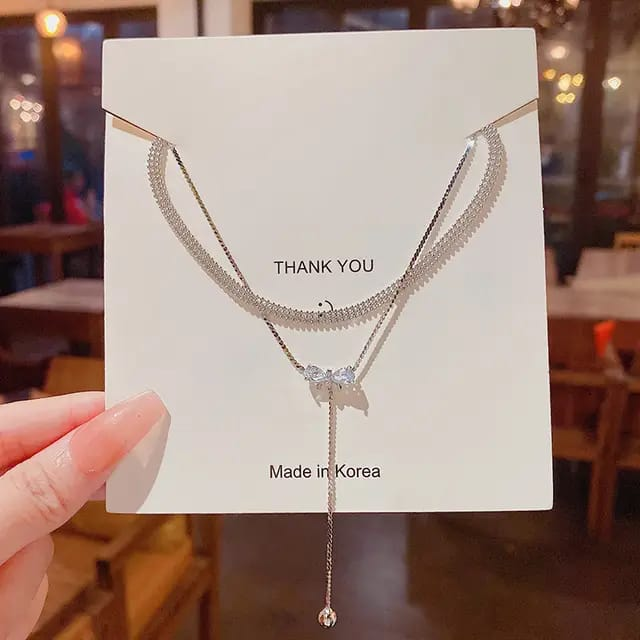 Silver-Tone Bow Charm Necklace – A Touch of Grace with an Elegant Layered Look