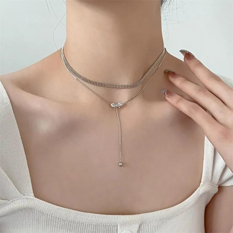Silver-Tone Bow Charm Necklace – A Touch of Grace with an Elegant Layered Look
