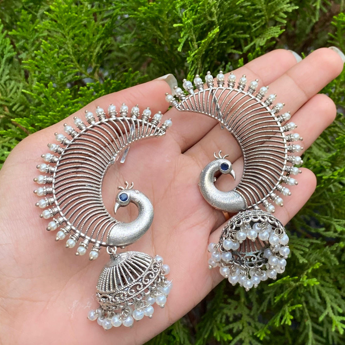 Silver Regal Peacock Pearl Jhumkas – A Majestic Blend of Grace and Tradition